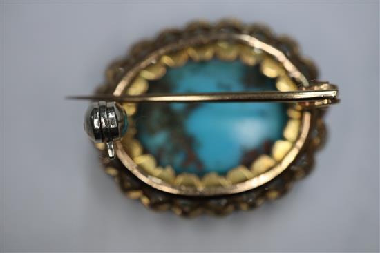 A Victorian yellow metal brooch, with oval turquoise cabochon surrounded by old-cut diamonds, 23mm.